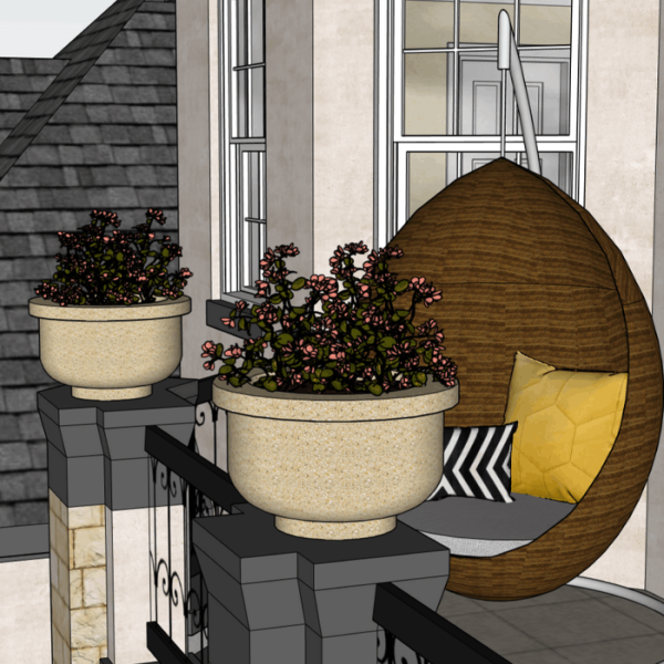 Kaks betoonvaasi, mis on pajakujulised, on asetatud maja rõdu äärtele.